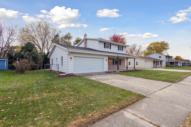 view of front property with a front yard and a garage