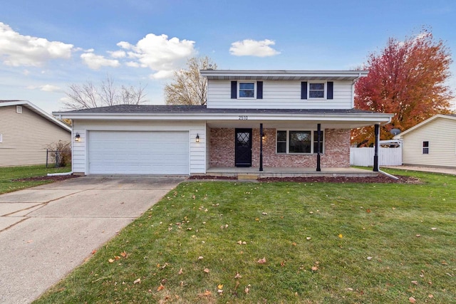 view of front property with a front yard, covered porch, and a garage