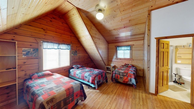 331 Hilltop Ct, Warrens, Warrens, WI 54666 - bedroom with wood walls, lofted ceiling, wooden ceiling, and light wood-style flooring