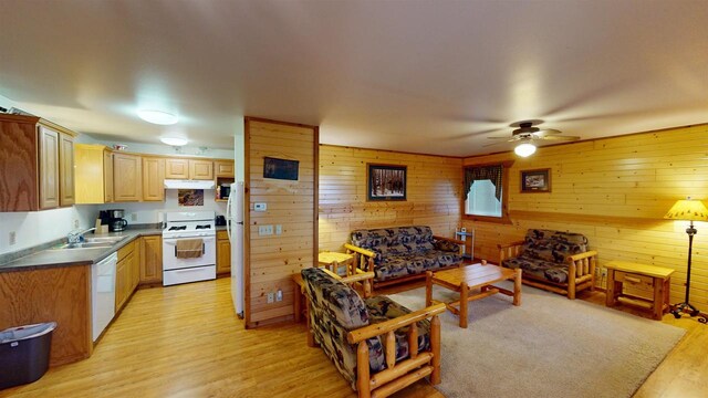 331 Hilltop Ct, Warrens, Warrens, WI 54666 - living room featuring light wood-style flooring, a ceiling fan, and wooden walls