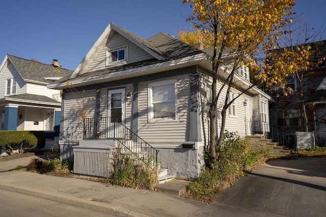 bungalow-style house featuring central air condition unit