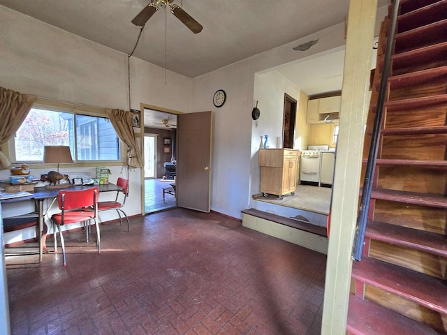 interior space with ceiling fan