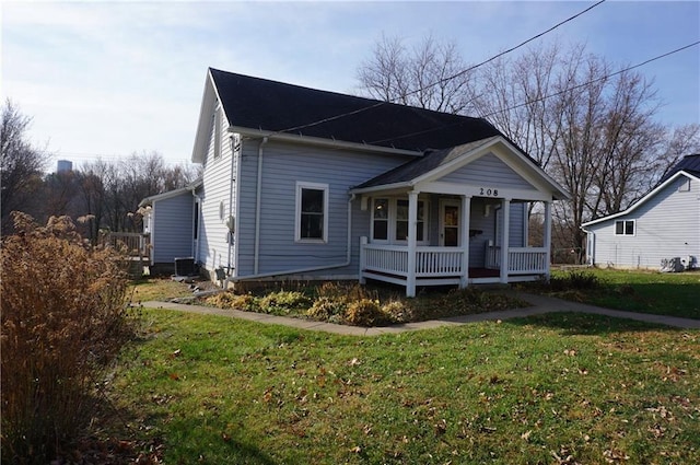 bungalow with a porch and a front yard