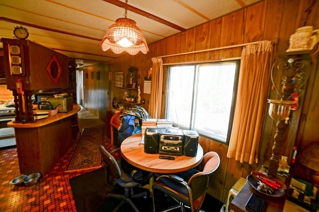 dining area with wooden walls