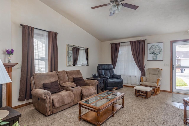 carpeted living room with ceiling fan and lofted ceiling