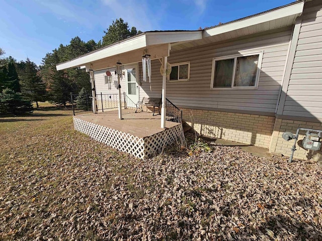 rear view of property with a deck