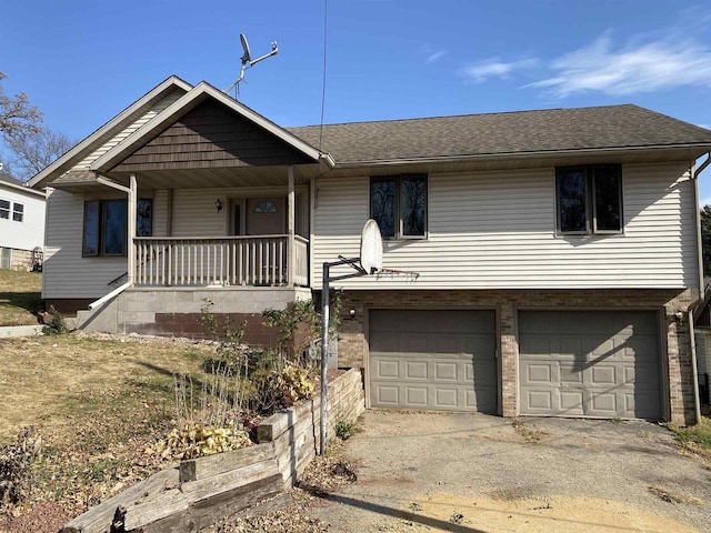 view of front of house with a garage and a porch