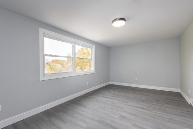 spare room featuring hardwood / wood-style floors