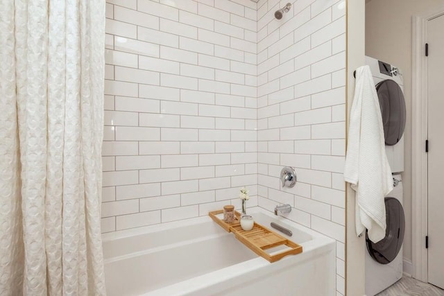 bathroom featuring shower / bath combination with curtain and stacked washing maching and dryer