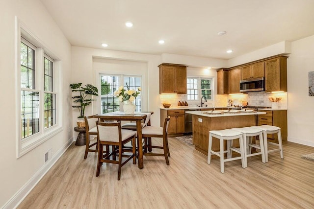 kitchen featuring sink, plenty of natural light, and light wood-type flooring