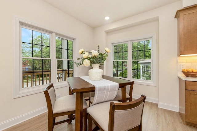 dining area with light hardwood / wood-style flooring