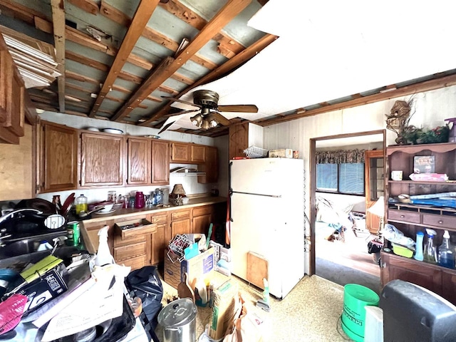 kitchen featuring ceiling fan and white refrigerator