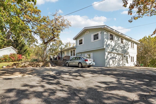 view of side of property featuring a garage