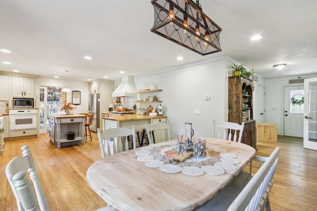 dining space with light wood-type flooring