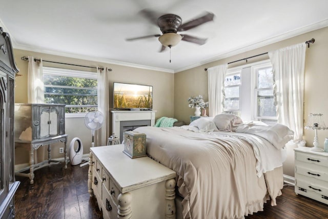 bedroom featuring ceiling fan, crown molding, multiple windows, and dark hardwood / wood-style floors