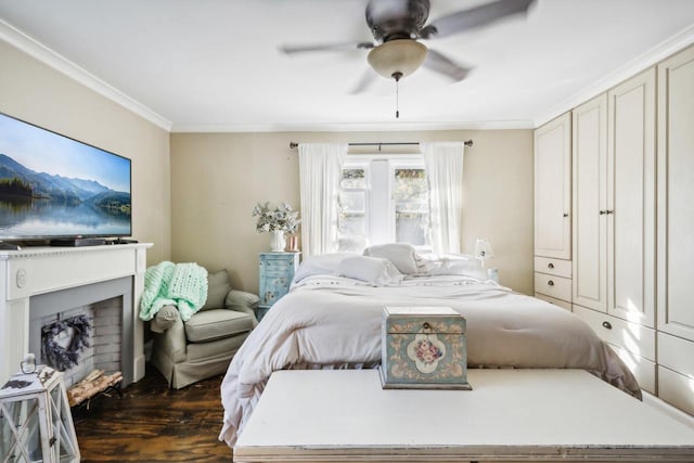 bedroom featuring ornamental molding, dark hardwood / wood-style floors, and ceiling fan