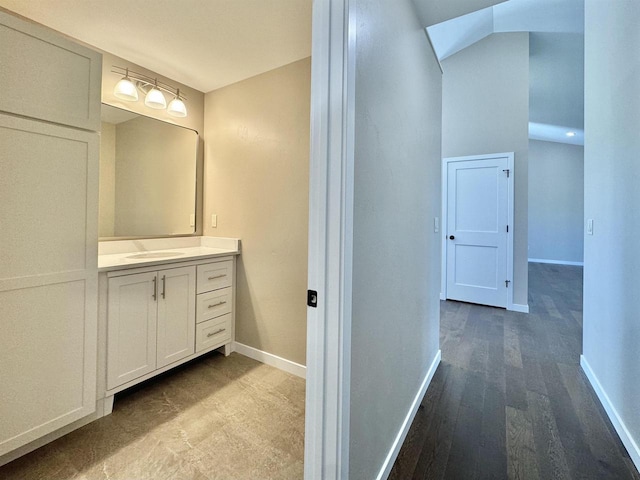 bathroom with vanity and wood-type flooring