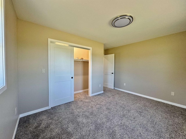 unfurnished bedroom featuring a closet and carpet floors