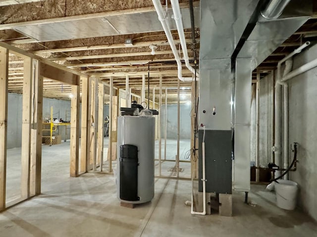 basement featuring water heater and heating unit