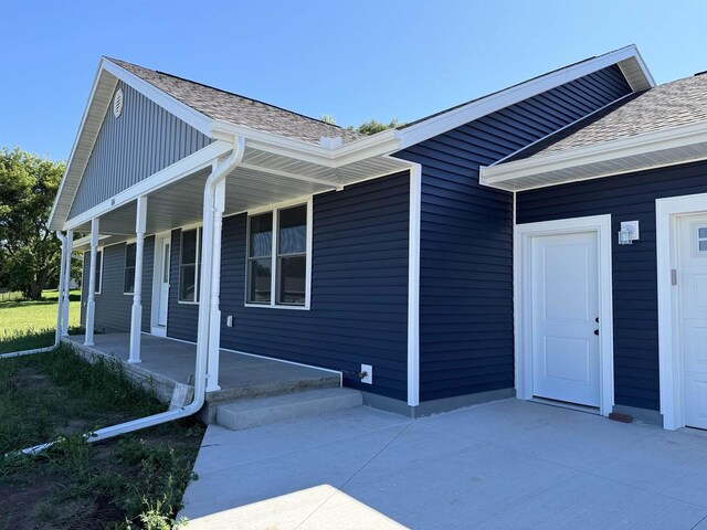 view of property exterior featuring a porch