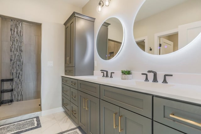 bathroom featuring vanity and tiled shower