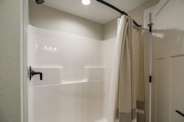 bathroom with a shower with curtain