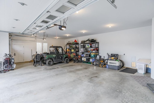 garage featuring a garage door opener