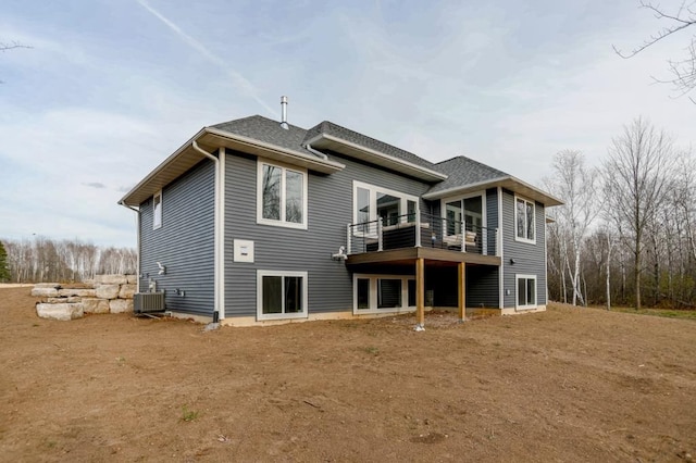 rear view of property featuring cooling unit