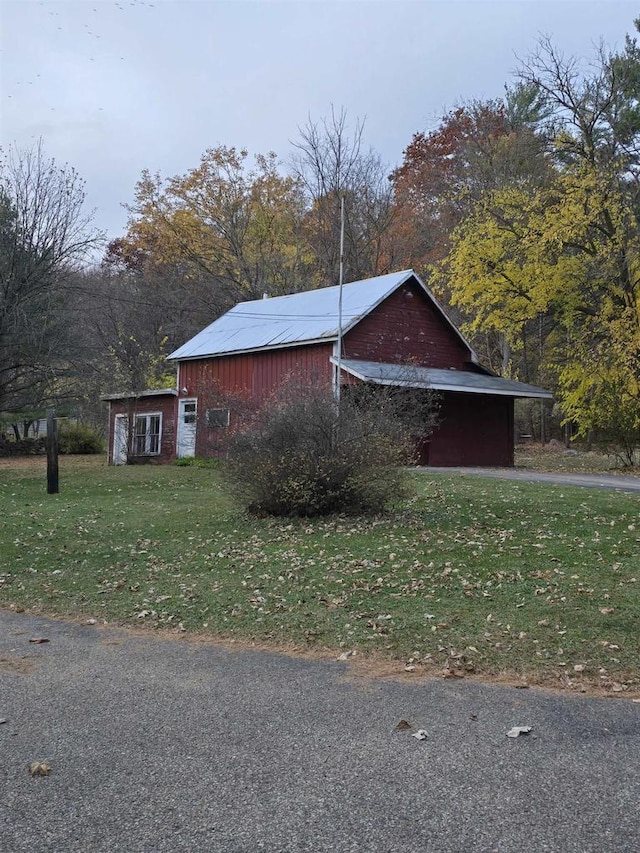 view of home's exterior featuring a yard