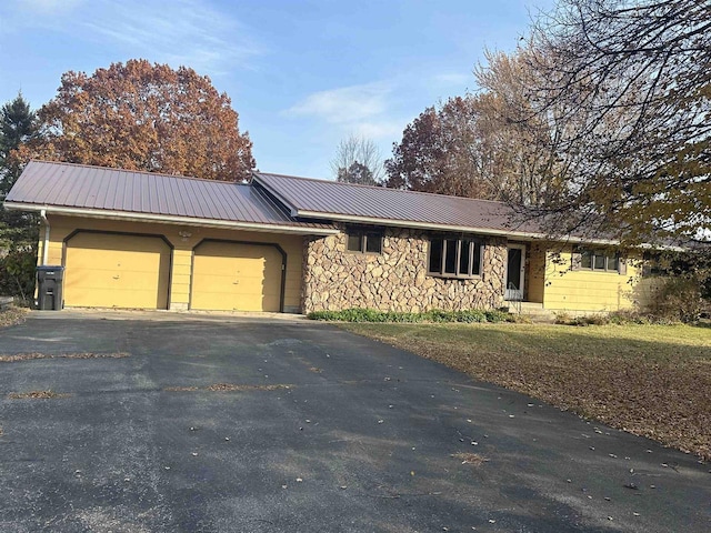 ranch-style home with a garage