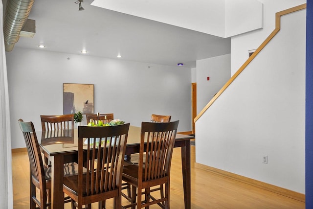 dining room with hardwood / wood-style flooring