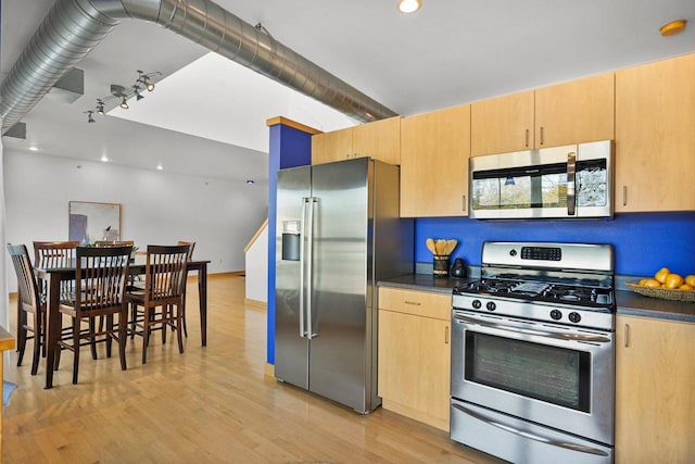 kitchen featuring appliances with stainless steel finishes, light brown cabinets, and light hardwood / wood-style floors