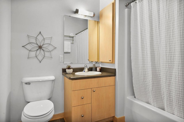 full bathroom featuring vanity, toilet, and shower / tub combo