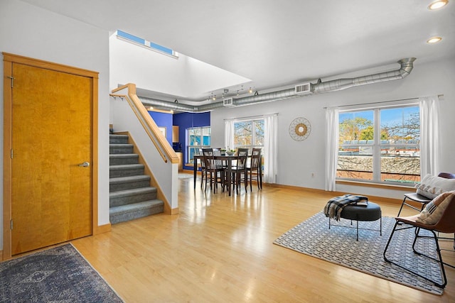 interior space featuring hardwood / wood-style flooring and a healthy amount of sunlight