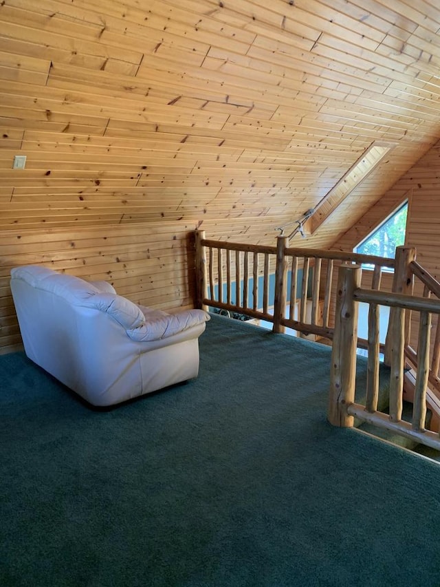 unfurnished room featuring carpet floors, wooden walls, and wooden ceiling