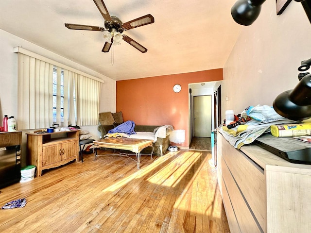 bedroom with light hardwood / wood-style floors and ceiling fan