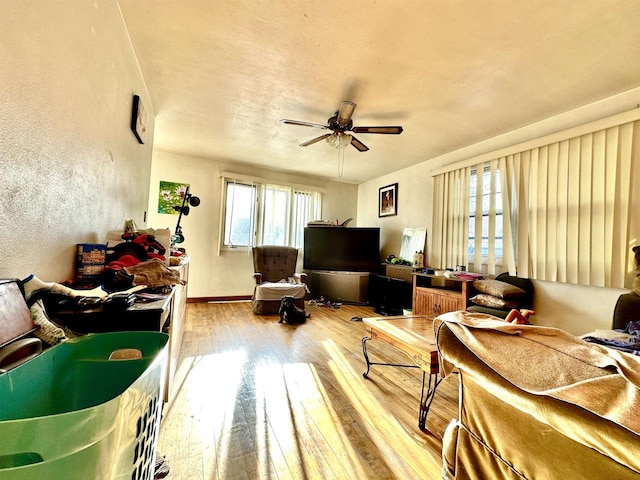 interior space with hardwood / wood-style flooring and ceiling fan