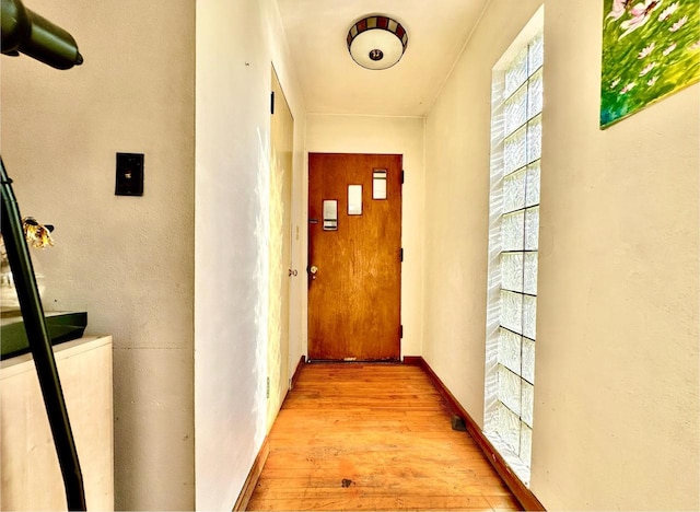 corridor featuring light hardwood / wood-style flooring