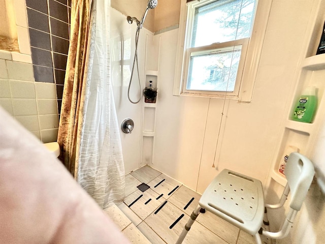 bathroom with a shower with shower curtain