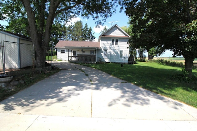 view of front of house featuring a front yard and covered porch