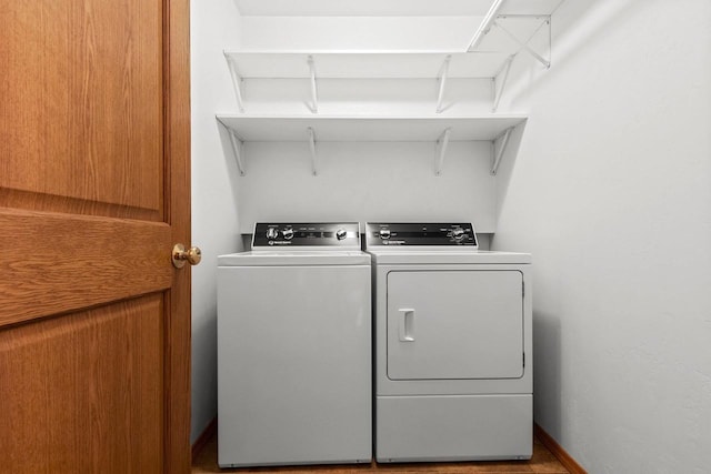 laundry room featuring separate washer and dryer