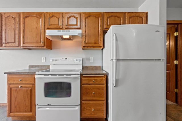 kitchen featuring white appliances and light tile patterned floors