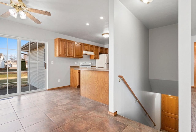 kitchen featuring white appliances and light tile patterned floors