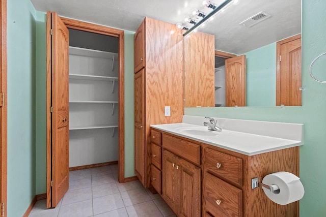 bathroom with vanity and tile patterned floors