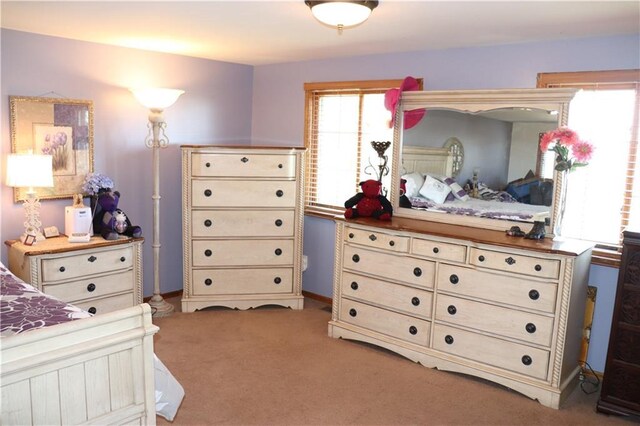 bedroom with light carpet