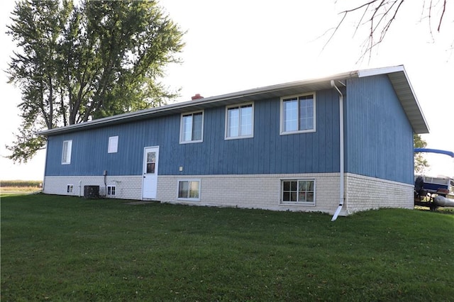 view of property exterior featuring a yard and central air condition unit