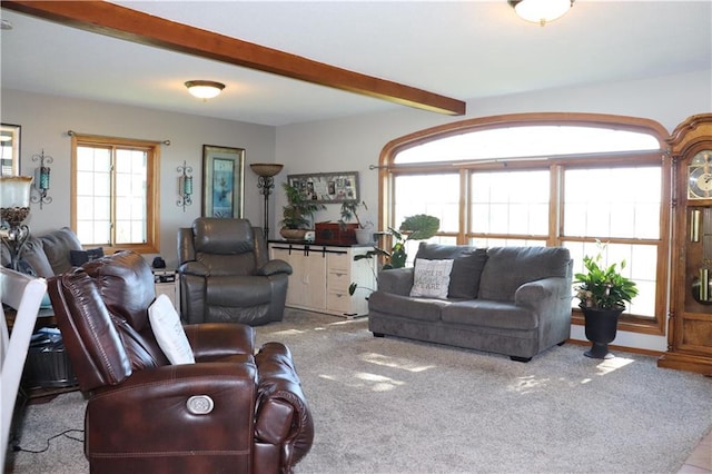 living room featuring beamed ceiling and light carpet