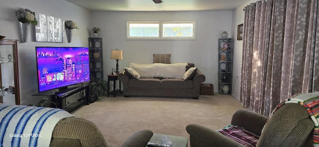 carpeted living room featuring ceiling fan