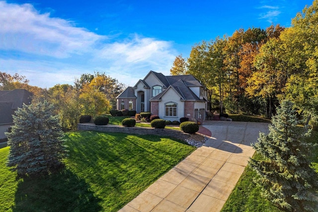 view of front facade featuring a front yard and a garage