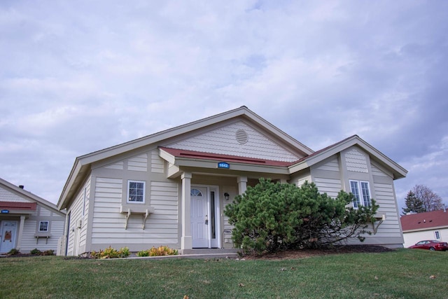 1642 Cottage Dr Unit 7-48, Lake Geneva, WI 53147 - bungalow-style house featuring a front lawn